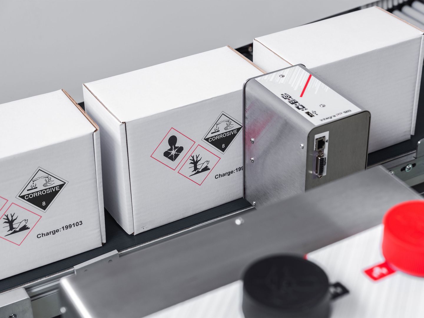 Markoprint integra PP 108 bicolor application—hazard symbol labeling on boxes