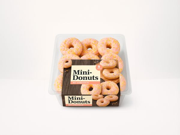 Labeling system Geset 218 C-Wrap labels on donuts