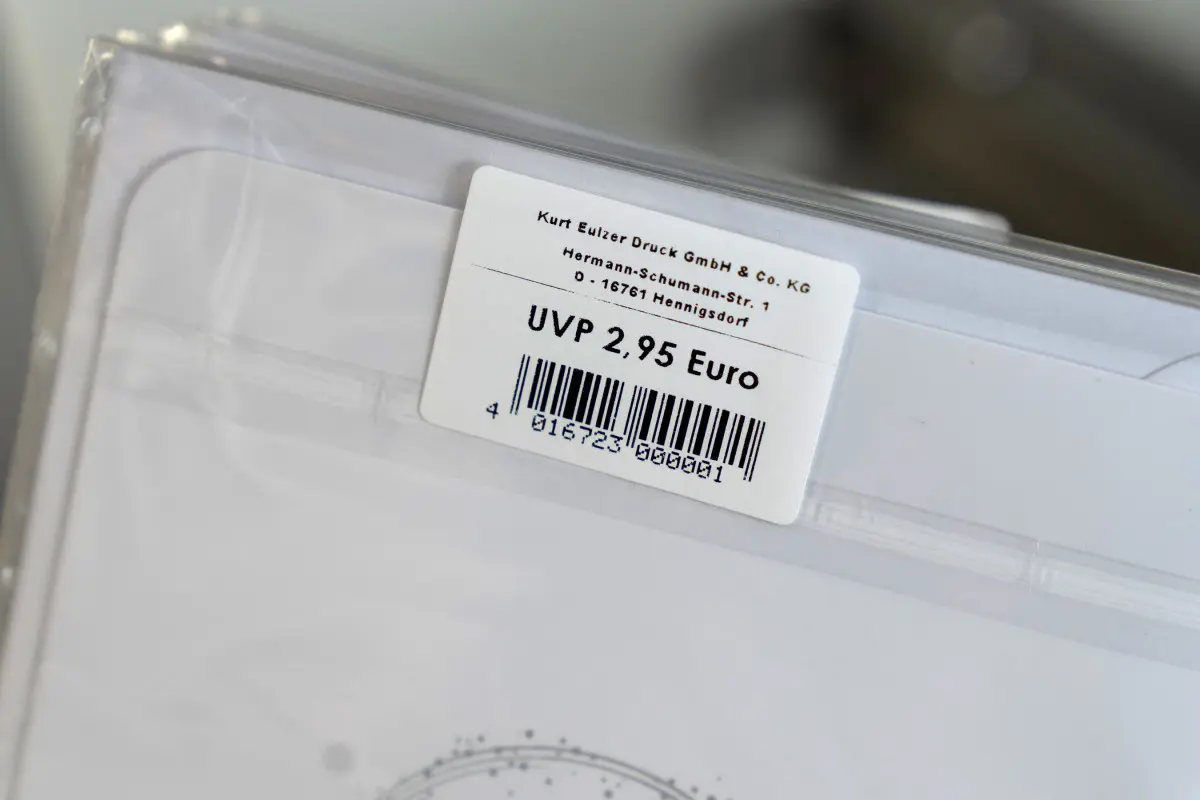Price tag on protective film of a card